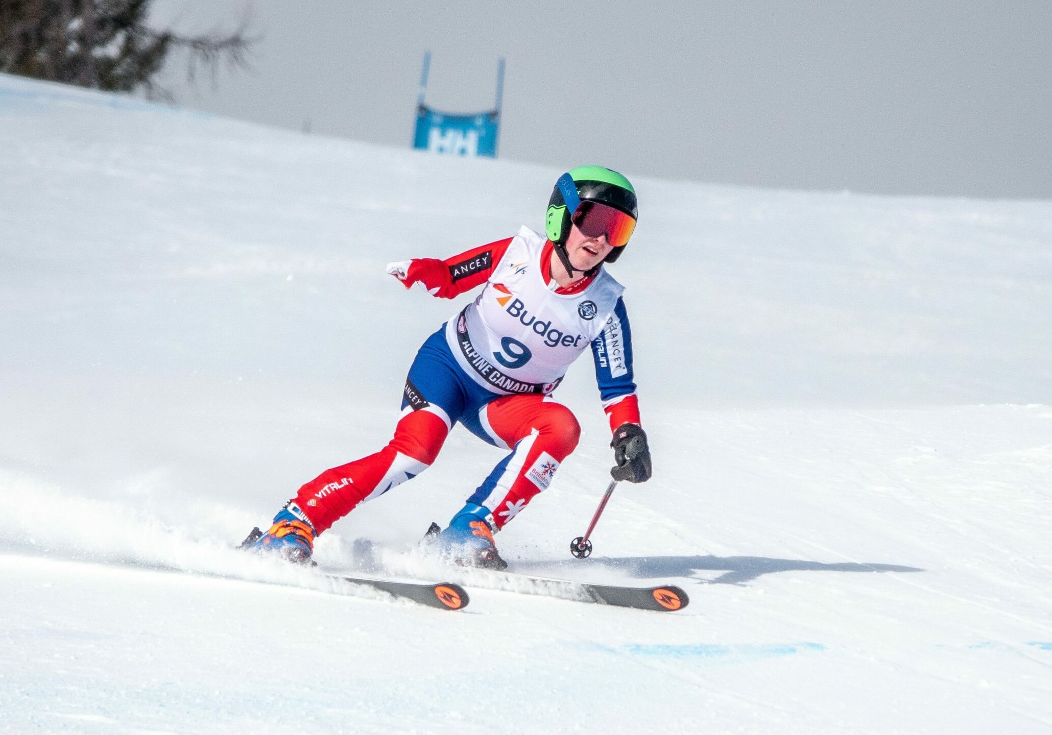 club member with cerebral palsy skiing and competing